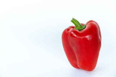 Close-up of red bell pepper against white background