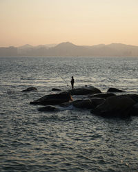 Scenic view of sea against sky during sunset