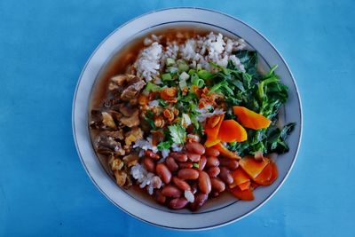 High angle view of chopped fruits in bowl on table