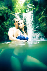 Young couple in swimming pool