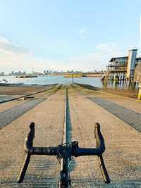 Rider view of bicycle on road looking into the river thames