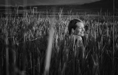 Girl standing in wheat field