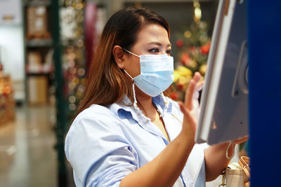 Portrait of woman working at store