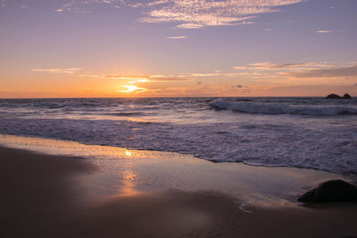 Scenic view of sea against dramatic sky