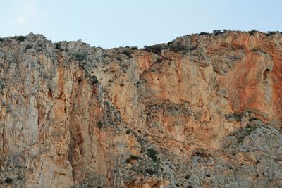 Scenic view of cliff against sky