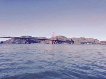 View of suspension bridge over sea