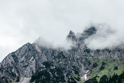 Scenic view of snow covered mountains against sky