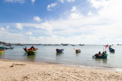 Boats on sea against sky