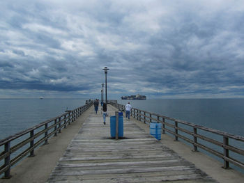 Pier over sea against sky