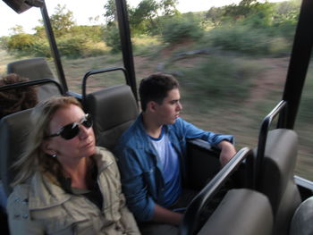 Young men sitting in car