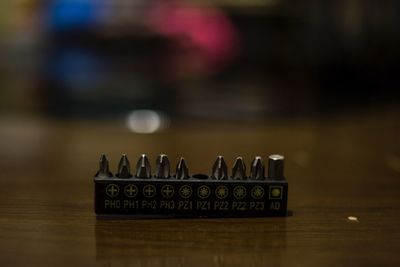 Close-up of information sign on table