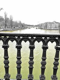 Close-up of railing against clear sky during winter