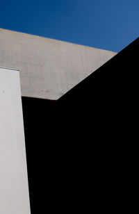 Low angle view of building against blue sky