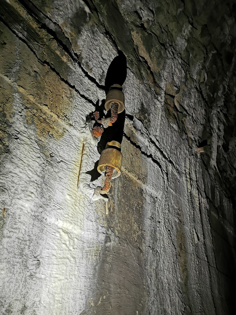 FULL LENGTH REAR VIEW OF MAN ON ROCK