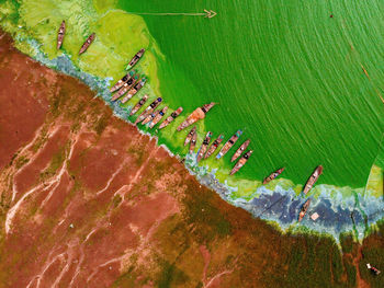 Aerial view of fishing boat moored at harbor