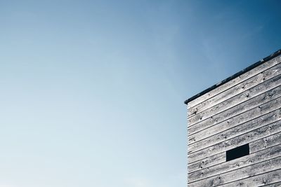 Low angle view of buildings against clear blue sky