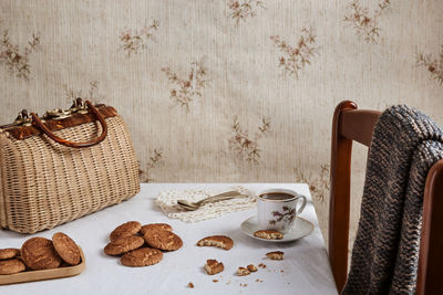 Table where someone is drinking hot coffee and homemade cookies