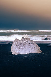 A ice diamond on the black beach of jökulsárlón in iceland