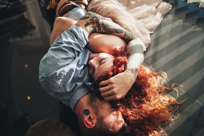 High angle view of friends relaxing at home