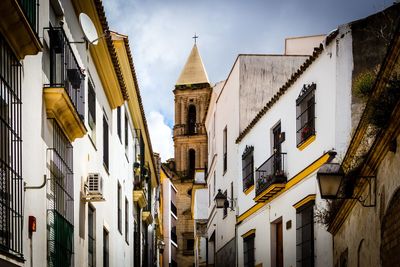 Low angle view of buildings against sky in city