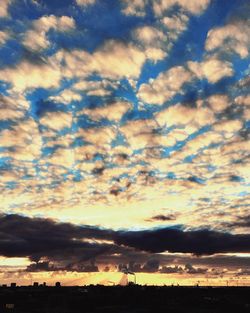 Scenic view of cloudy sky at sunset