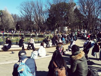 People at town square against sky