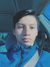 Portrait of young man in car