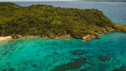 Aerial view of beautiful tropical island with white sand beach, hotels and tourists, boracay. 