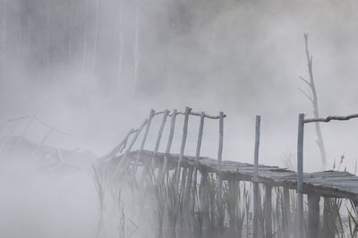 Panoramic shot of wooden post against sky