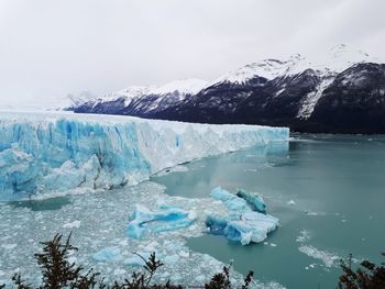 Scenic view of frozen lake against sky