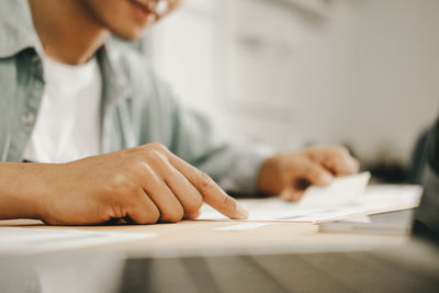 Midsection of man on table