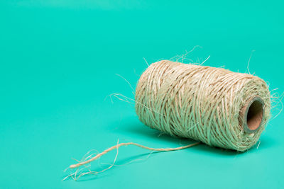 Close-up of rope tied on table