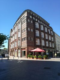 Low angle view of building against clear blue sky