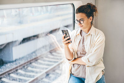 Young woman using mobile phone