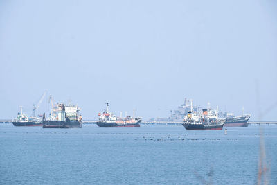 Ship in sea against clear sky