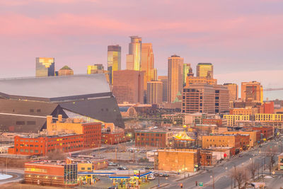 High angle view of buildings in city against sky during sunset