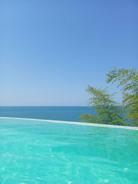 Scenic view of sea against clear blue sky