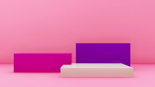 Close-up of pink box against blue background