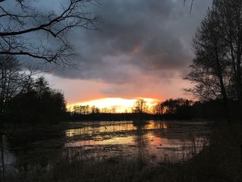 Scenic view of lake against sky during sunset