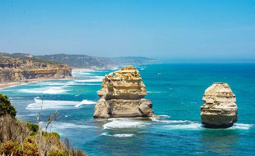 Scenic view of sea against clear blue sky