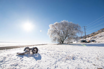 Ski lift on snow field against sky