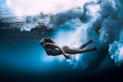 Full length of woman swimming in sea