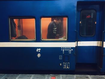 Reflection of train on glass window