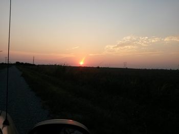 Scenic view of field against sky during sunset