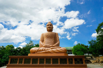 Low angle view of statue against sky