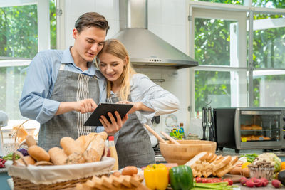 Young couple holding food