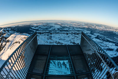 High angle view of cityscape against clear sky during winter