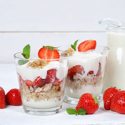 Close-up of strawberries and fruits on table