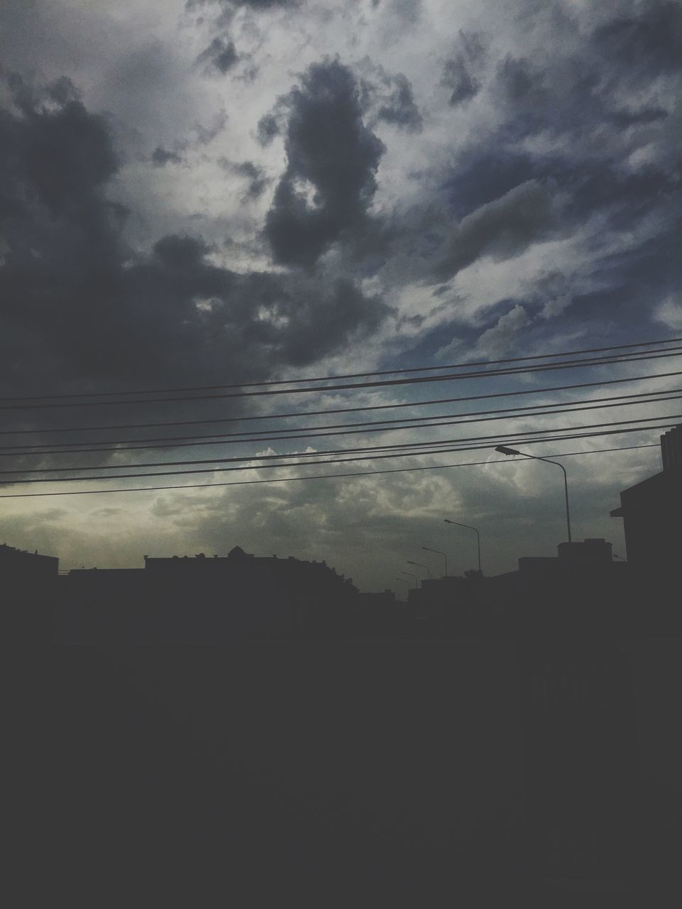 sky, cloud - sky, silhouette, built structure, architecture, building exterior, cloudy, low angle view, cloud, weather, sunset, dusk, house, nature, power line, outdoors, scenics, beauty in nature, no people, dark