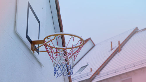 Low angle view of basketball hoop against clear sky